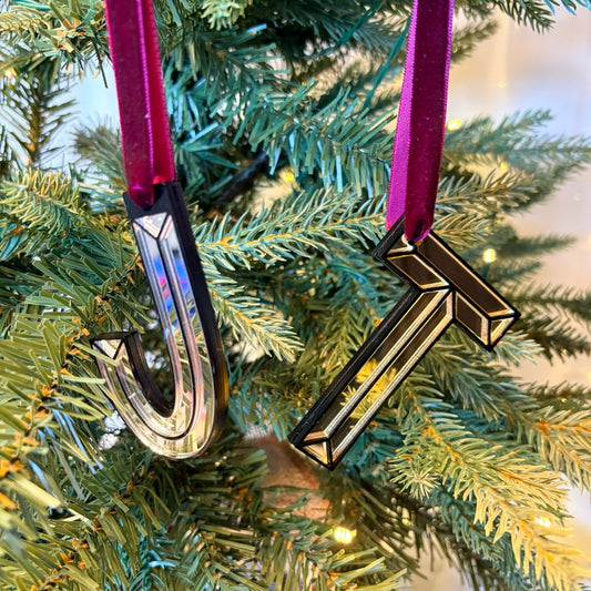 Gold mirrored initial T Christmas decoration hanging on tree
Silver acrylic initial J Christmas ornament with velvet ribbon