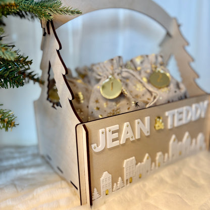 Decorative gift box with 'JEAN & TEDDY' text, Christmas tree in the background